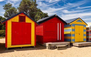 Colorful bathing houses on white sandy beach at Brighton in Melbourne, Australia.
