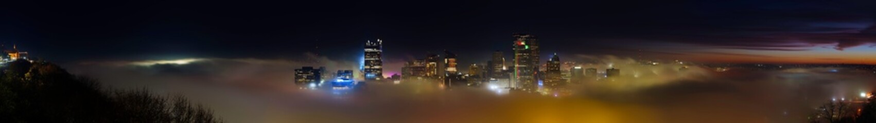 Pittsburgh Skyline Nightscape over the Fog and Illuminated City Lights in Pennsylvania, USA: The...