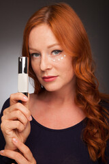 Skin Care. Beauty Portrait Of Woman Holding Bottle With Dropper Near Face. Model Using Natural...