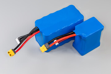 Rechargeable battery packs with power and control wires in covering