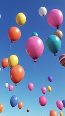 A grand display of multicolored balloons floating in a clear blue sky