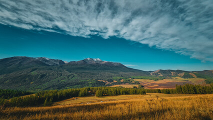 Obraz premium kanasi lake landscape or mountain view, scenery of mountain in China, travel destination or tour tourism, xinjiang, majestic panorama nature view. destination, blue sky, hill top, calmness.