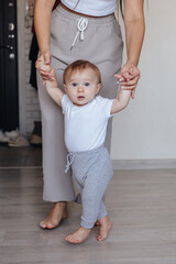 Mother and baby legs. First steps.