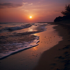 Dusk sunset at the beach, sun is over the ocean horizon as the waves cascade onto the shore