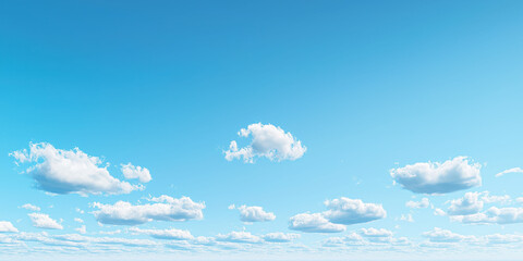 Clear blue sky with fluffy white clouds on a sunny day