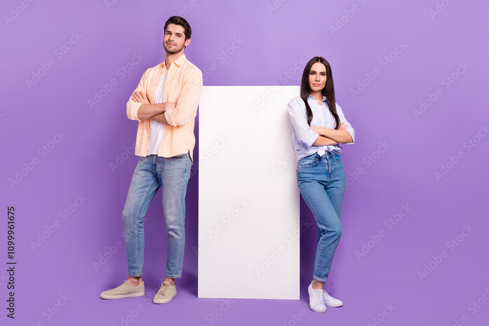 Poster full length photo of two attractive people crossed arms empty space big telephone isolated on violet