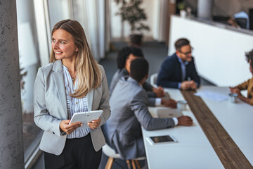 Professional Woman Leading Business Meeting with Colleagues in Office