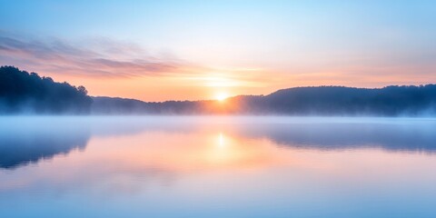 Serene sunrise over calm waters at Griggs Reservoir, featuring a gentle mist that adds to the tranquil beauty of the scene, highlighting the peaceful atmosphere at Griggs Reservoir.