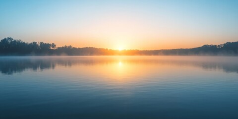Serene sunrise over calm waters at Griggs Reservoir, featuring a gentle mist that adds to the tranquil beauty of the scene, highlighting the peaceful atmosphere at Griggs Reservoir.