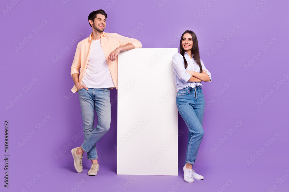 Poster Full size photo of two people showing empty space huge smart phone touchscreen isolated on violet color background