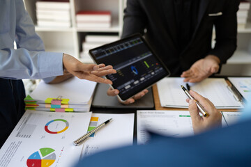 Meeting with financial advisors to analyze production costs and analyze marketing charts in...