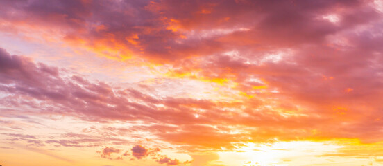 Obraz premium Morning clouds and sky,Panorama sunset sky and cloud background,Orange sky and clouds background,Background of colorful sky concept, amazing sunset with twilight sky and clouds 