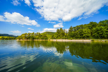 View of Lake Diemelsee and the surrounding landscape. Idyllic nature at the reservoir in Sauerland.
