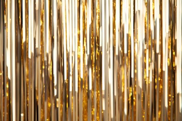 Shiny metallic tinsel curtain backdrop with vibrant sparkles, perfect for festive party decorations in gold and silver 