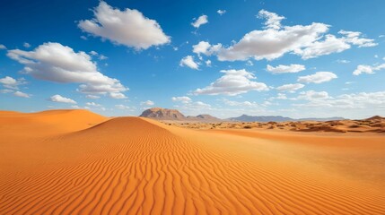 Orange Desert Sand Dunes Under a Blue Sky