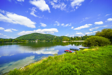 Fototapeta premium View of Lake Diemelsee and the surrounding landscape. Idyllic nature at the reservoir in Sauerland. 