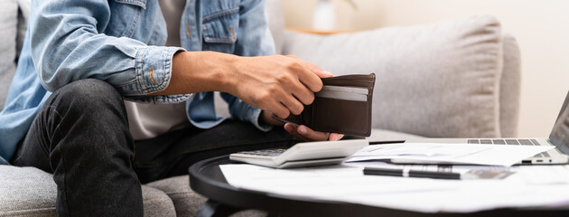 Bankruptcy problem financial concept, Young man opening empty wallet stress to find money to pay...