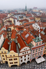 Fototapeta premium Aerial panoramic view of the city of Prague with its typical houses on a cloudy day, Czech Republic.