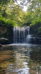 Fototapeta premium Stunning Waterfall in Lush Forest Landscape