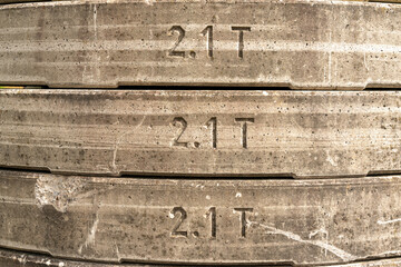 Stacked concrete counterweights of a crane, 2.1 tons each, give an interesting texture for...