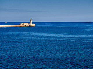 View of the lighthouse at the entrance to the port of Valletta, Malta