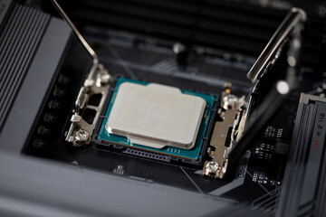 Fototapeta premium Closeup of a CPU expertly installed on a motherboard, showcasing its intricate design