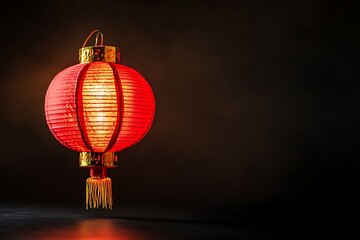 Obraz premium A glowing red lantern with a tassel, symbolizing celebration and culture.