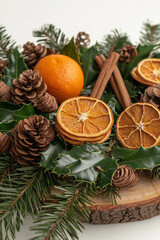 christmas decorations close-up with dried oranges, cinnamon and pine branches