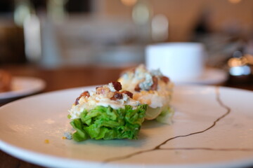 cabbage with cheese Young early cabbage baked in pieces in the oven