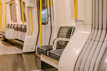 Empty seats inside an underground carriage in London, England