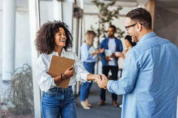 Diverse Professionals Engaging in a Friendly Business Meeting