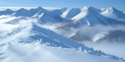 Obraz premium A breathtaking snowy mountain ridge rises above deep valleys, showcasing natural beauty