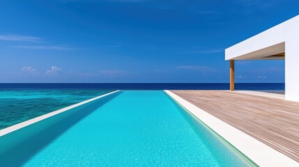 Fototapeta premium A stunning infinity pool overlooks a vibrant blue ocean, featuring a minimalist design and a sunlit deck, creating a serene and luxurious atmosphere.
