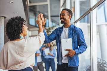 Professional Team Celebrating Success with a Joyful High Five