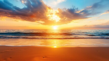 Golden sunset over the ocean, dramatic sky reflecting on the water, tranquil beach scene