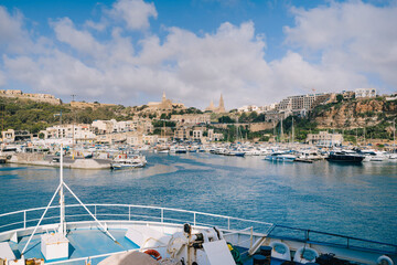 Harbour and dock of Gozo island, Mgarr. Gozo ferry Malta. Island landscape and seascape in the Maltese archipelago on a sunny day. Travel cruise by ship. Southern Europe background.