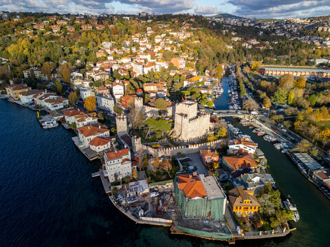Aerial view of the historic anatolian fortress at sunset with beautiful houses and lush greenery along the bosphorus and goksu creek, Anadolu Hisari, Turkey.