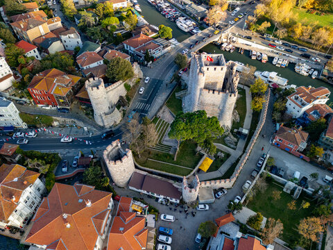 Aerial view of the historic anadolu hisari fortress with stone walls and rooftops overlooking the bosphorus and goksu creek, istanbul, turkey.
