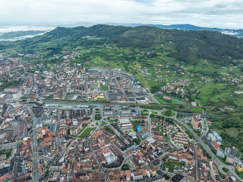 Aerial view of the beautiful historic old town with medieval architecture and surrounding mountains, Oviedo City, Spain.