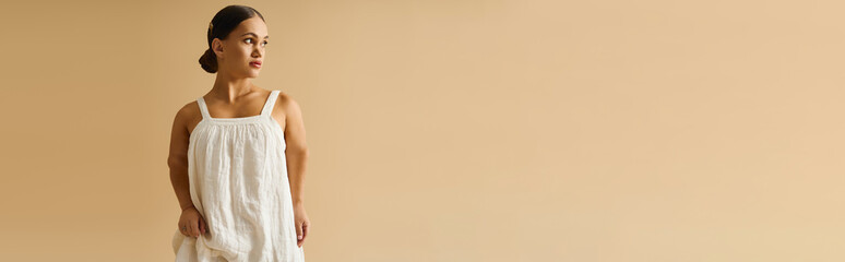 Young woman with short stature poses gracefully in a stylish dress, emphasizing diversity.