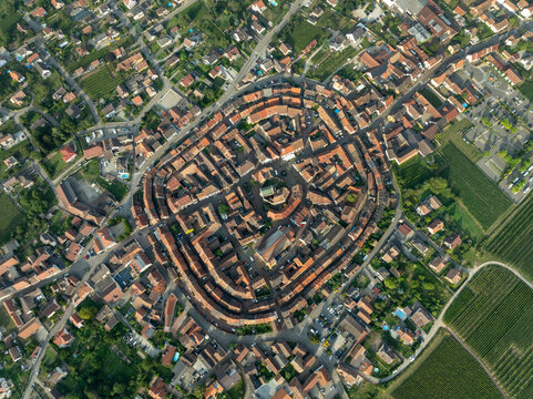 Aerial view of picturesque medieval village with charming homes and vineyards, Eguisheim, France.