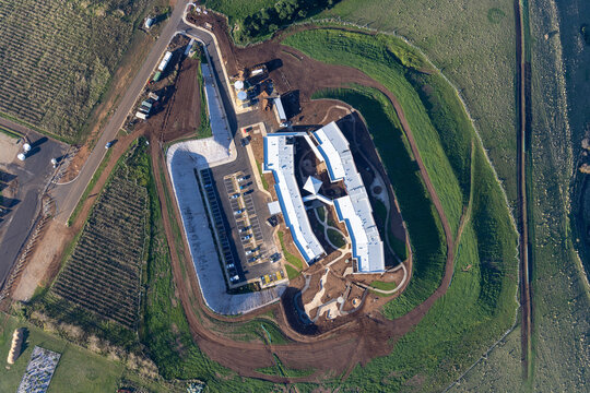 Aerial view of anam cara house hospital surrounded by greenery and urban development, Waurn Ponds, Victoria, Australia.