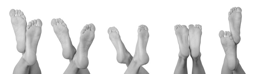 Set of grayscale bare female feet showing the sole, heel, and bottom views. Smooth, soft skin...