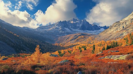 Fototapeta premium Majestic mountain range in autumn. Vibrant foliage blankets the valley below.