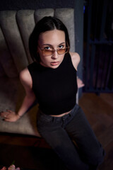 A stylish woman struts into the bar at night, exuding elegance and seduction of nightlife