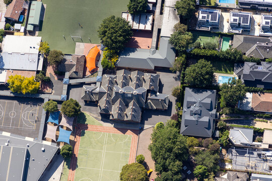 Aerial view of beautiful Brighton suburb with residential buildings, sports fields, and greenery, Melbourne, Victoria, Australia.