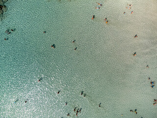 Aerial view of beautiful Elafonissi beach with clear blue water and people enjoying the sun, Sklavopoula, Crete, Greece.