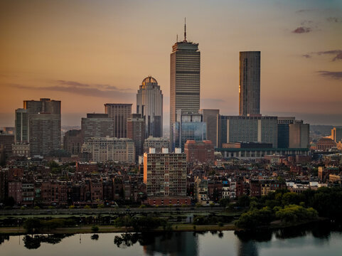 Aerial view of boston skyline at sunset with prudential center and john hancock building, boston, united states.