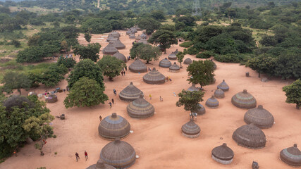 Aerial view of traditional thatch huts in a picturesque village surrounded by trees, Udi, Nigeria.