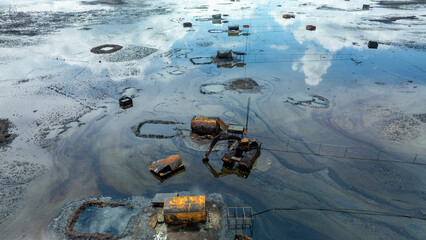 Aerial view of oil spillage affecting contaminated water and industrial structures, Degema, Nigeria.